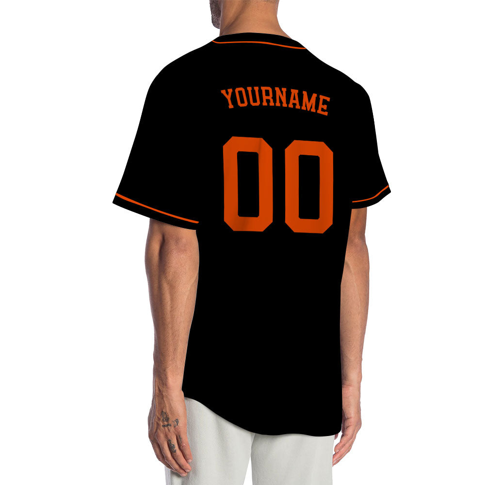 Custom black baseball jersey with orange lettering and piping